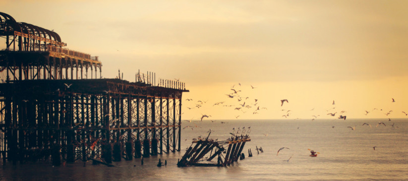 Beautiful seaport with birds flying above the sea