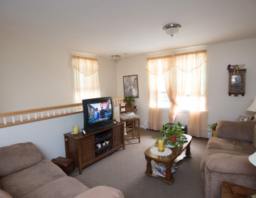 A living area with a working television